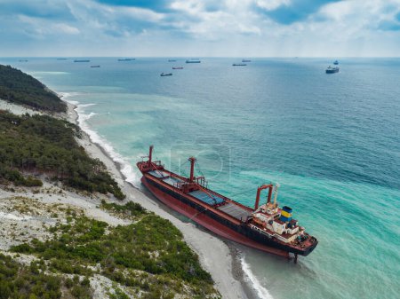 Photo for Cargo ship stranded after a storm, aerial view - Royalty Free Image