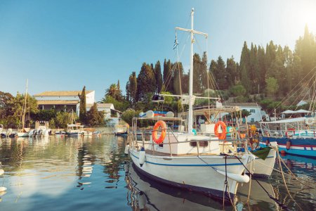 Photo for Colorful fishing boats docked in the harbor of Kalami, Corfu island, Greece - Royalty Free Image