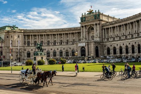 Photo for Vienna, Austria, September 28 2022 Hofburg palace and panoramic square view, people walking and fiaker with horses in Vienna, Austria - Royalty Free Image