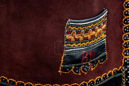 Foto de Sewing details of sheepskin vests garments romanian traditional - Imagen libre de derechos