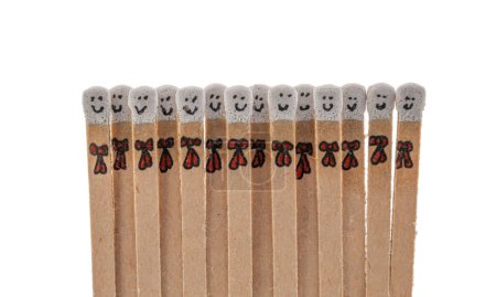 Photo for Matchsticks with faces painted on the heads on white background - Royalty Free Image