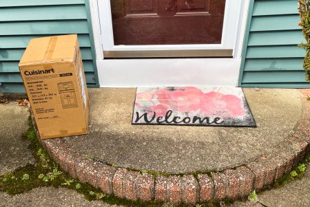 Photo for Babylon, New York, USA - 12 March 2023: A cuisinart blander in a cardboard box is delivered and left on my front stoop in view for anyone to steal. - Royalty Free Image