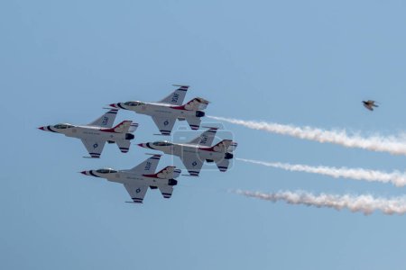Photo for Wantagh, New York, USA - 26 May 2023: United States Air Force Thunderbird demonstration team performing the diamond formationin an airshow over Jones Beach Long Island. - Royalty Free Image