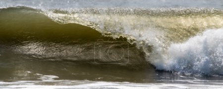 Photo for A very large wave formed from a storm off shore breaking close up. - Royalty Free Image