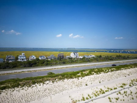 Photo for Drone view over the sand dunes of Giglgo Beach at houses and the great south bay on the south shore of Long Island New York. - Royalty Free Image