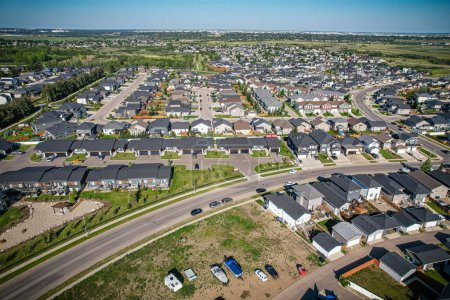Photo for Stunning birds-eye perspective of the Evergreen neighborhood in Saskatoon, showcasing the unique urban layout and the natural beauty of Saskatchewans landscapes. - Royalty Free Image