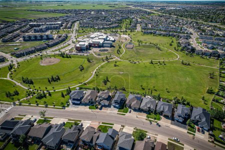 Photo for Elevated panorama of Willowgrove, showcasing the neighborhoods modern aesthetics intertwined with pockets of lush green, epitomizing Saskatoons suburban beauty - Royalty Free Image