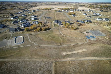 Photo for Drone image capturing the beauty of Edgemont Estates in Saskatoon, Saskatchewan, with its spacious residential properties and natural surroundings - Royalty Free Image