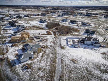 Drone image showcasing the beauty of Grasswood Estates in Saskatoon, Saskatchewan, with its spacious residential properties and natural surroundings