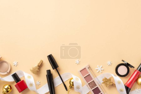 Photo for Christmas shopping concept. Top view photo of decorative cosmetics lip gloss nail polish mascara eyeshadow palettes golden baubles snowflakes curly ribbon on isolated beige background with blank space - Royalty Free Image