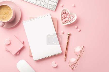 Téléchargez les photos : Valentine's Day concept. Top view photo of planners pen stylish glasses heart shaped saucer sprinkles sticky note paper keyboard cup of hot drinking on isolated pastel pink background with copyspace - en image libre de droit