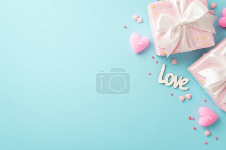 Foto de Valentine's Day concept. Top view photo of light pink gift boxes with white ribbon bows inscription love heart shaped candles and sprinkles on isolated pastel blue background with empty space - Imagen libre de derechos