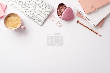Photo for Valentine's Day concept. Top view photo of keyboard notebooks stylish pen heart shaped clips holder and cup of coffee on isolated white background with empty space - Royalty Free Image
