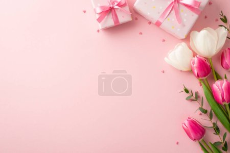 Photo for Mother's Day concept. Top view photo of present boxes with ribbon bows bouquet of spring flowers and heart shaped sprinkles on isolated pastel pink background with copyspace - Royalty Free Image
