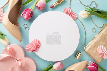 Photo for Glamorous Mother's Day idea. Flat lay top view concept with high-heels, handbag, gift box, tulip flowers, lipstick, makeup brushes, and earrings on a pastel blue background with empty circle - Royalty Free Image