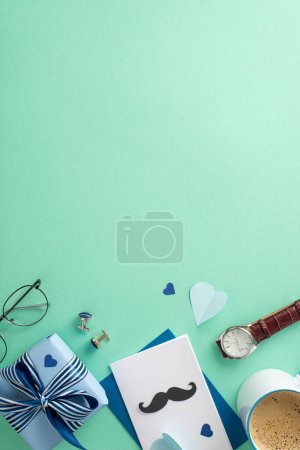 Photo for Modern Father's Day design. Top view arrangement of envelope, giftbox, postcard with mustaches, clock, accessories, cufflinks, spectacles, mug of coffee on teal background with space for text - Royalty Free Image