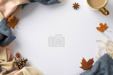 Photo for Experience the feeling of warming up in fall season with warm patchy plaid and a mug of hot cocoa drink and maple leaves around on this high angle photo on white isolated background with empty circle - Royalty Free Image