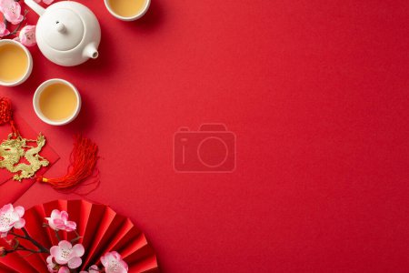 Photo for Celebrate vibrancy of Chinese New Year. Top view photo of fan and traditional decorations symbolizing prosperity and good fortune. Share joy and blessings with loved ones on this auspicious occasion - Royalty Free Image