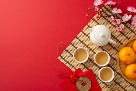 Photo for Traditional Chinese New Year elegance: Top view image showcasing green tea ceremony essentials, chopsticks, bamboo placemat, symbolic coin hanging, tangerine, sakura on red surface with space for text - Royalty Free Image