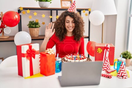 Photo for Young hispanic woman smiling confident celebrating online birthday at home - Royalty Free Image