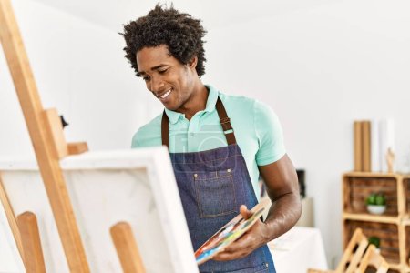 Photo for Young african american artist man smiling happy drawing at art studio. - Royalty Free Image