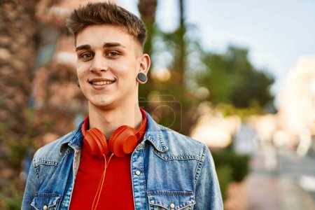 Photo for Young caucasian guy smiling at the city - Royalty Free Image