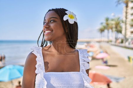 Photo for Young african american girl smiling happy standing at the beach - Royalty Free Image