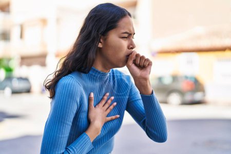 Photo for Young african american woman coughing at street - Royalty Free Image