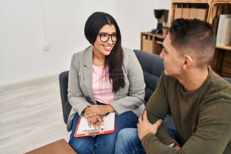 Photo for Man and woman having psychology session at clinic - Royalty Free Image