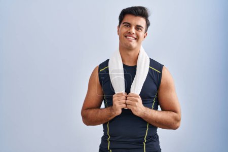 Photo for Young hispanic man smiling confident holding towel at sport center - Royalty Free Image