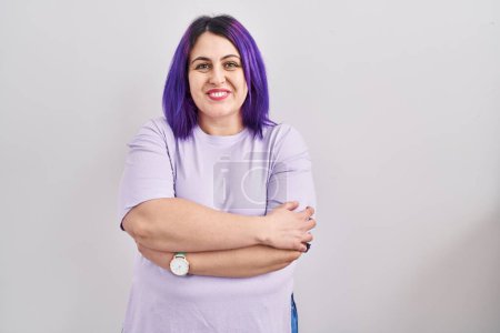 Téléchargez les photos : Plus size woman wit purple hair standing over isolated background happy face smiling with crossed arms looking at the camera. positive person. - en image libre de droit