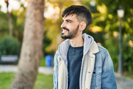 Photo for Young hispanic man smiling confident looking to the side at park - Royalty Free Image