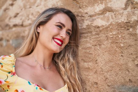 Photo for Young beautiful hispanic woman smiling confident looking to the side over isolated stone background - Royalty Free Image