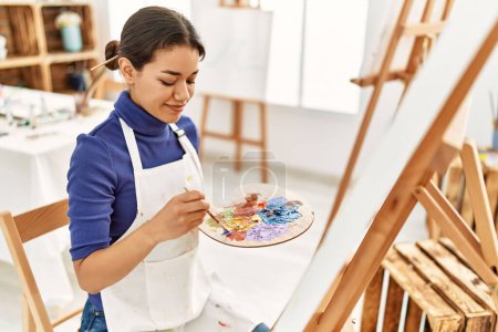 Photo for Young latin woman smiling confident drawing at art studio - Royalty Free Image