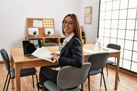 Photo for Young hispanic woman business worker smiling confident working at office - Royalty Free Image