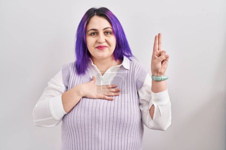Photo for Plus size woman wit purple hair standing over white background smiling swearing with hand on chest and fingers up, making a loyalty promise oath - Royalty Free Image