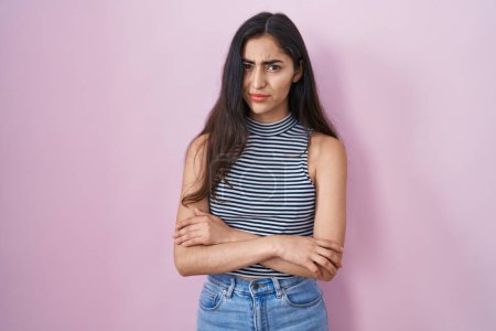 Téléchargez les photos : Young teenager girl wearing casual striped t shirt skeptic and nervous, disapproving expression on face with crossed arms. negative person. - en image libre de droit