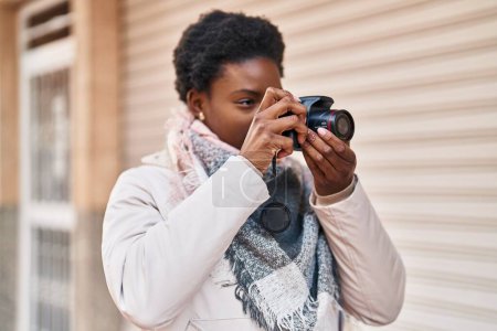 Photo for African american woman smiling confident using professional camera at street - Royalty Free Image