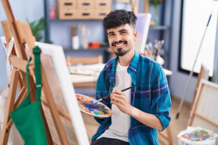 Photo for Young hispanic man artist smiling confident drawing at art studio - Royalty Free Image