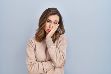Photo for Young woman standing over isolated background thinking looking tired and bored with depression problems with crossed arms. - Royalty Free Image