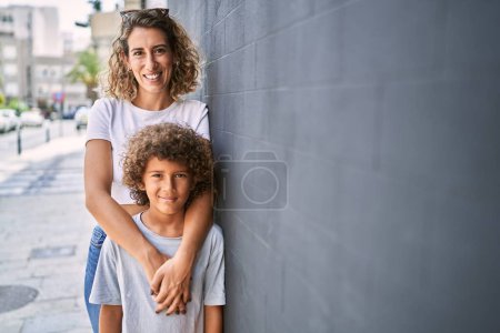 Photo for Mother and son smiling confident hugging each other at street - Royalty Free Image