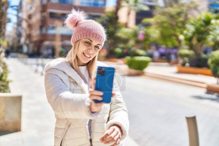 Photo for Young woman smiling confident making selfie by the smartphone at street - Royalty Free Image