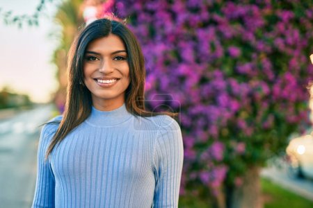 Photo for Beautiful hispanic woman smiling confient at the park - Royalty Free Image