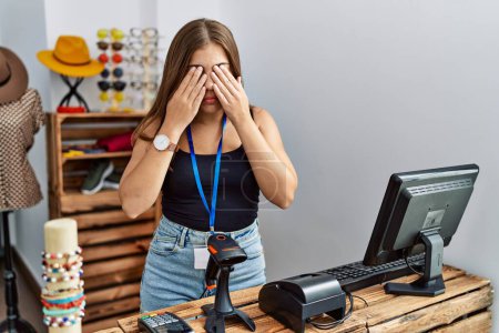 Photo for Young brunette woman holding banner with open text at retail shop rubbing eyes for fatigue and headache, sleepy and tired expression. vision problem - Royalty Free Image