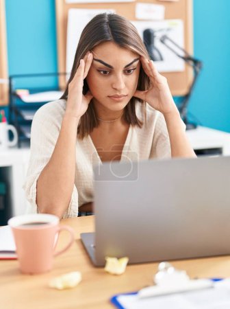Photo for Young beautiful hispanic woman business worker stressed using laptop at office - Royalty Free Image