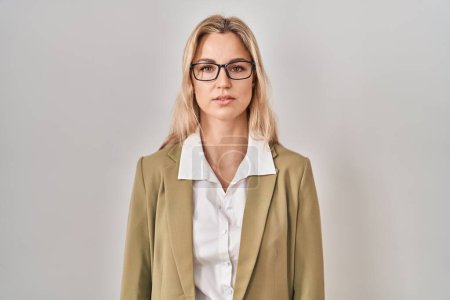 Photo for Young caucasian woman wearing glasses with serious expression on face. simple and natural looking at the camera. - Royalty Free Image