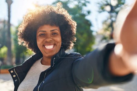 Photo for African american woman smiling confident making selfie by camera at park - Royalty Free Image