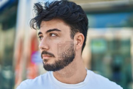 Photo for Young hispanic man with relaxed expression standing at street - Royalty Free Image