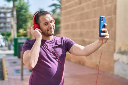 Photo for Young man smiling confident having video call at street - Royalty Free Image