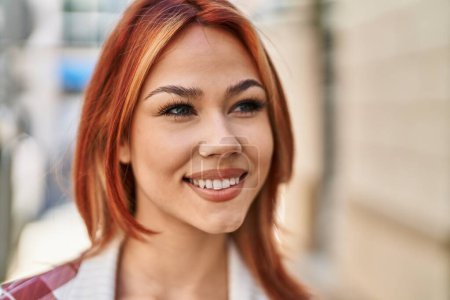 Photo for Young caucasian woman smiling confident looking to the side at street - Royalty Free Image